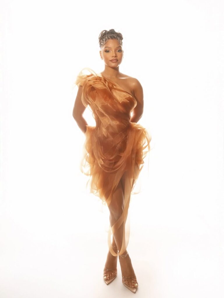 Halle Bailey Shined in a Stunning Copper Look at Vogue World: Hollywood | See Photos